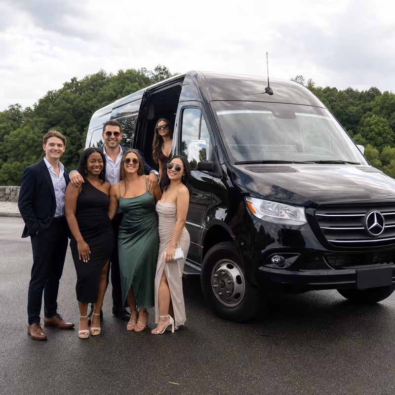 Group beside a Mercedes Sprinter limo from the Trenton fleet