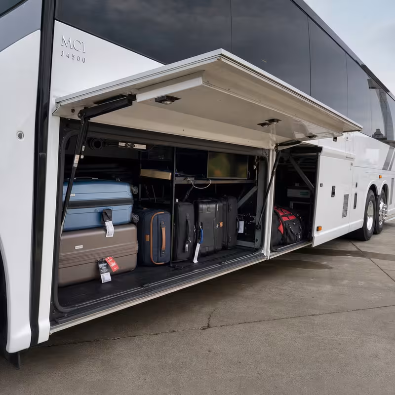 Party bus interior with wraparound leather seating and LED lighting in Trenton