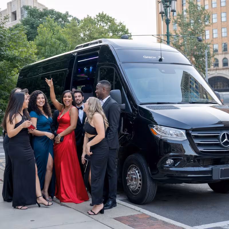 Group boarding a white charter bus for Bachelor & Bachelorette Transportation transportation in Trenton
