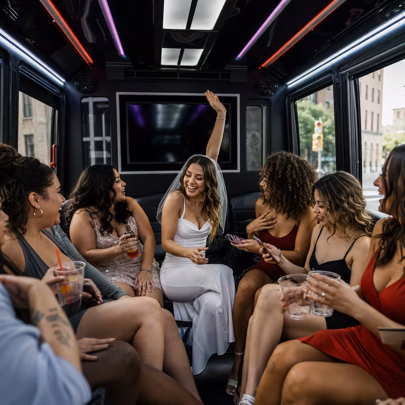 Party bus interior with wraparound leather seating and LED lighting in Trenton