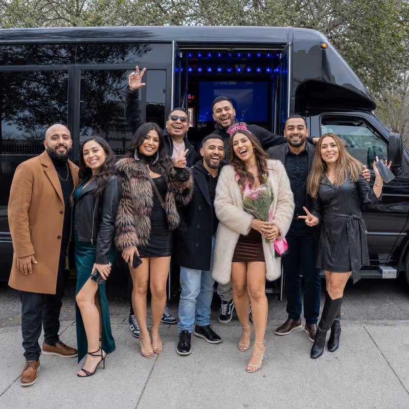 Group boarding a white charter bus for Birthday Transportation transportation in Trenton