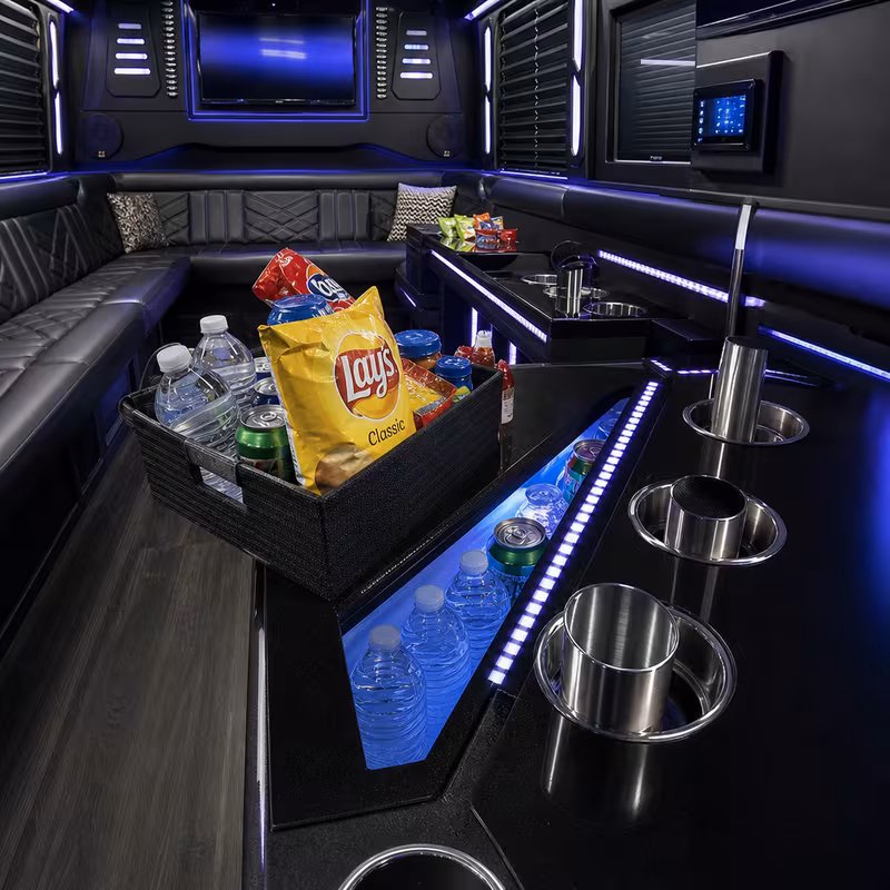 Party bus interior with wraparound leather seating and LED lighting in Trenton